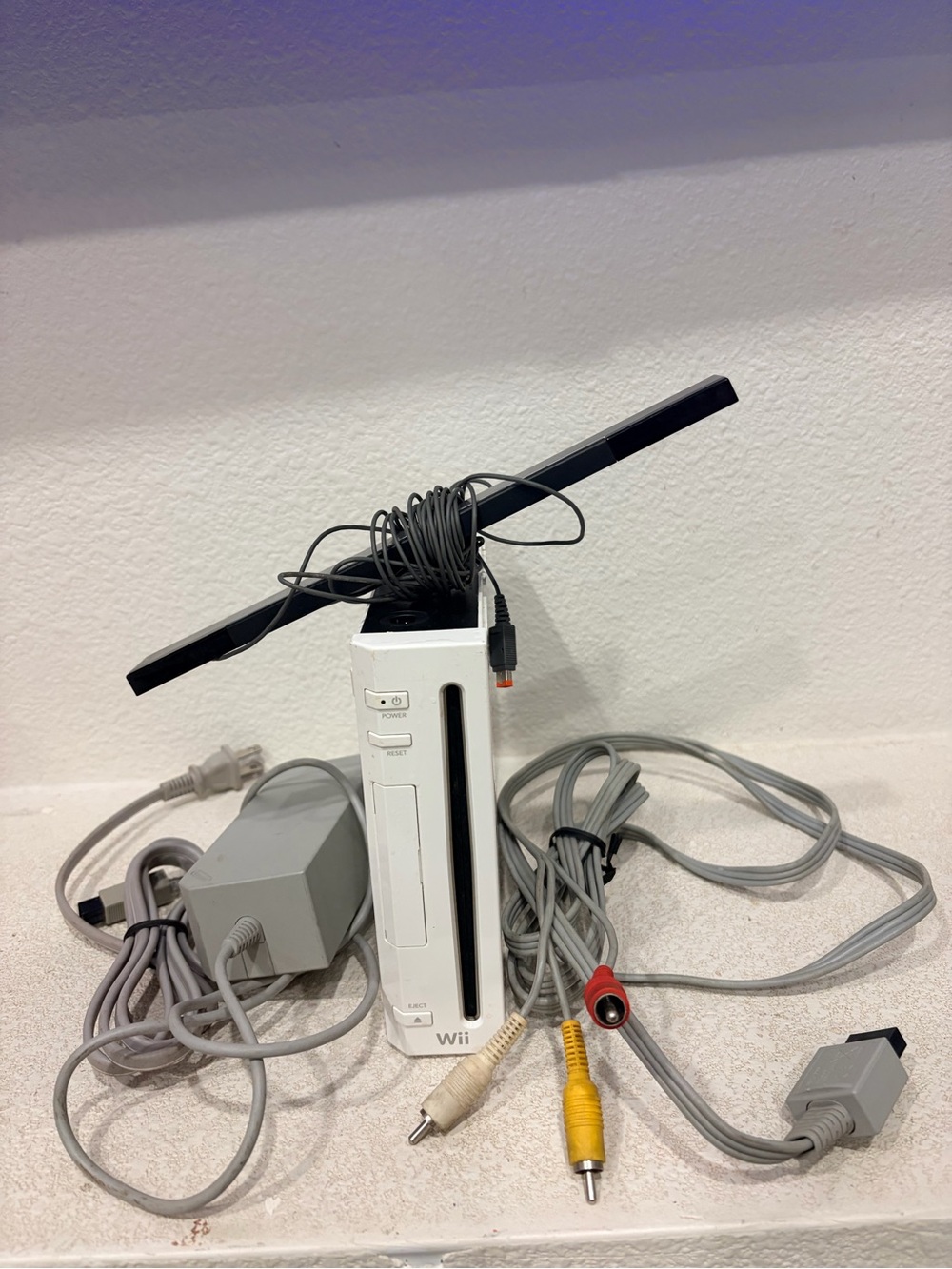 Nintendo Wii Console Bundle in White with Black Sensor Bar and Gray Cables